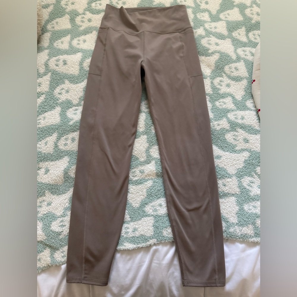 Women’s taupe leggings 
Worn twice
Size medium 
2 pockets on either side